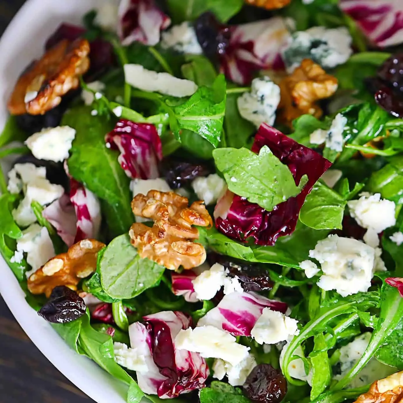 Arugula Salad with Walnuts, Golden Raisins, and Gorgonzola Cheese