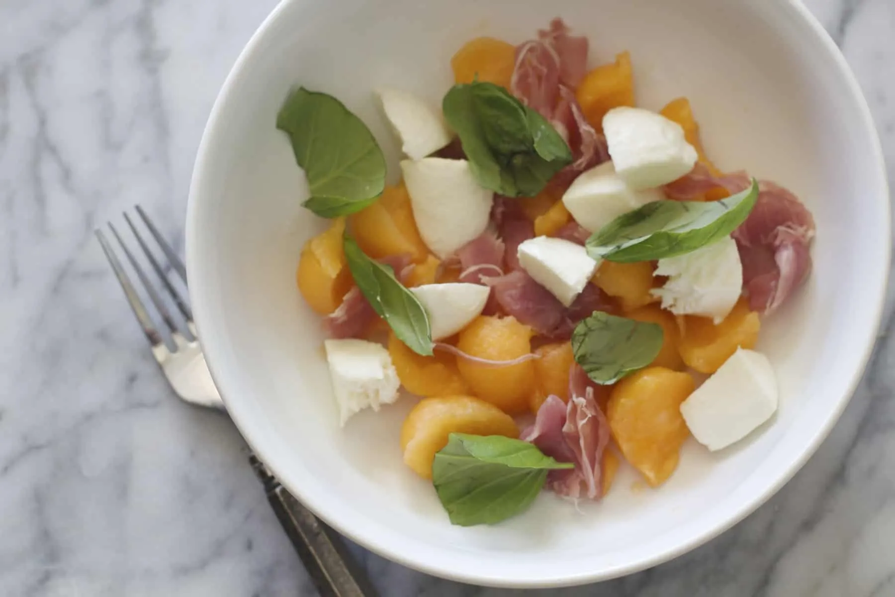 Cantaloupe Salad with Basil, Fresh Mozzarella, Onions