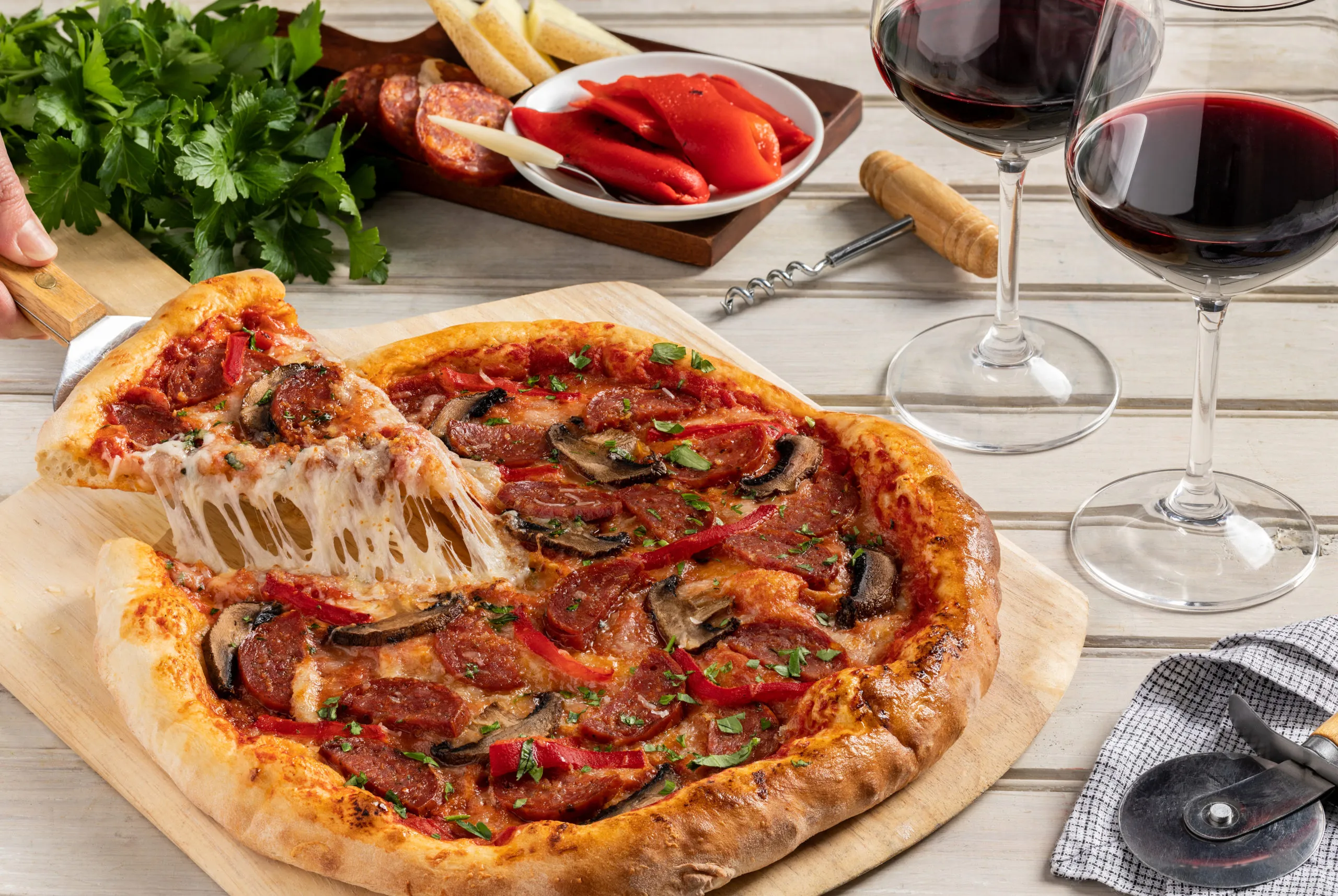 Crispy Chorizo Fontina Manchego Pizza with Piquillo Peppers and Arugula