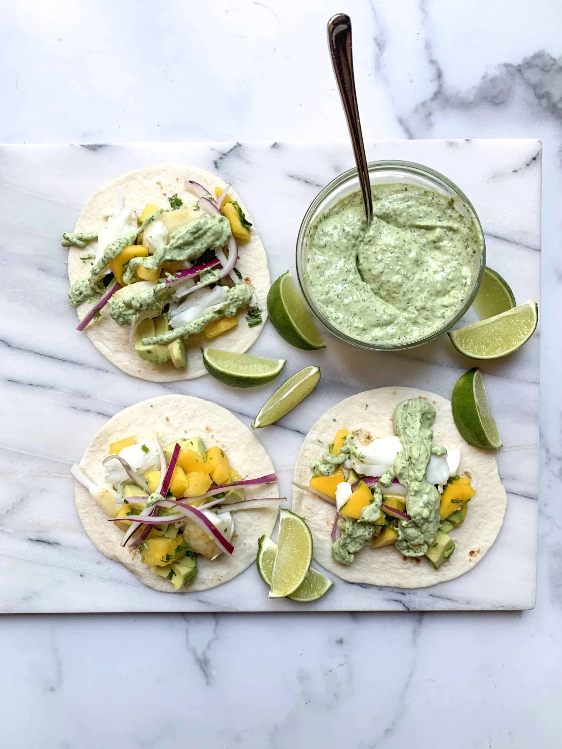 Easy Fish Tacos with Mango Salsa and Avocado Crema