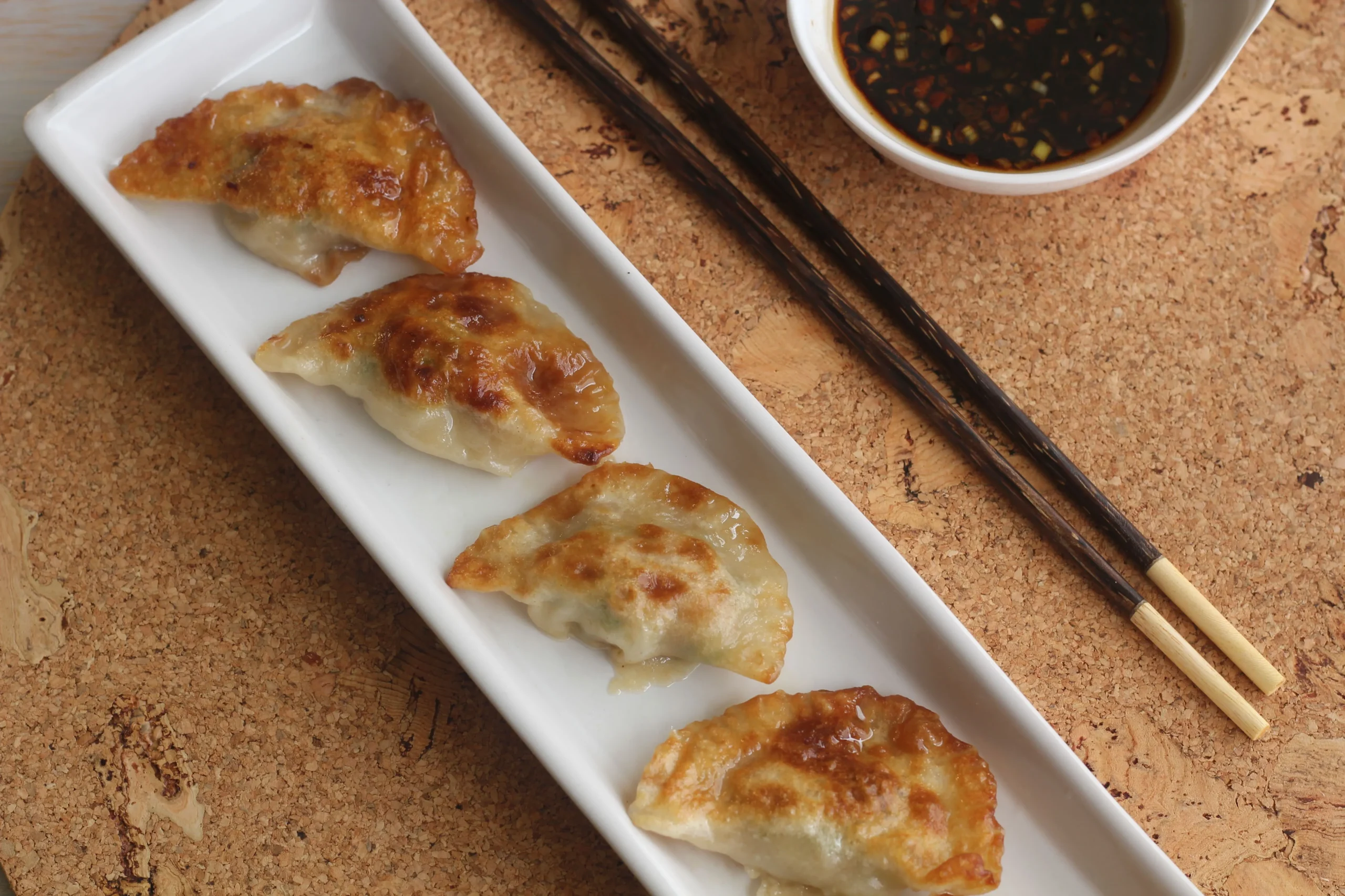 Emeril's Pork Dumplings with Spicy Sauce