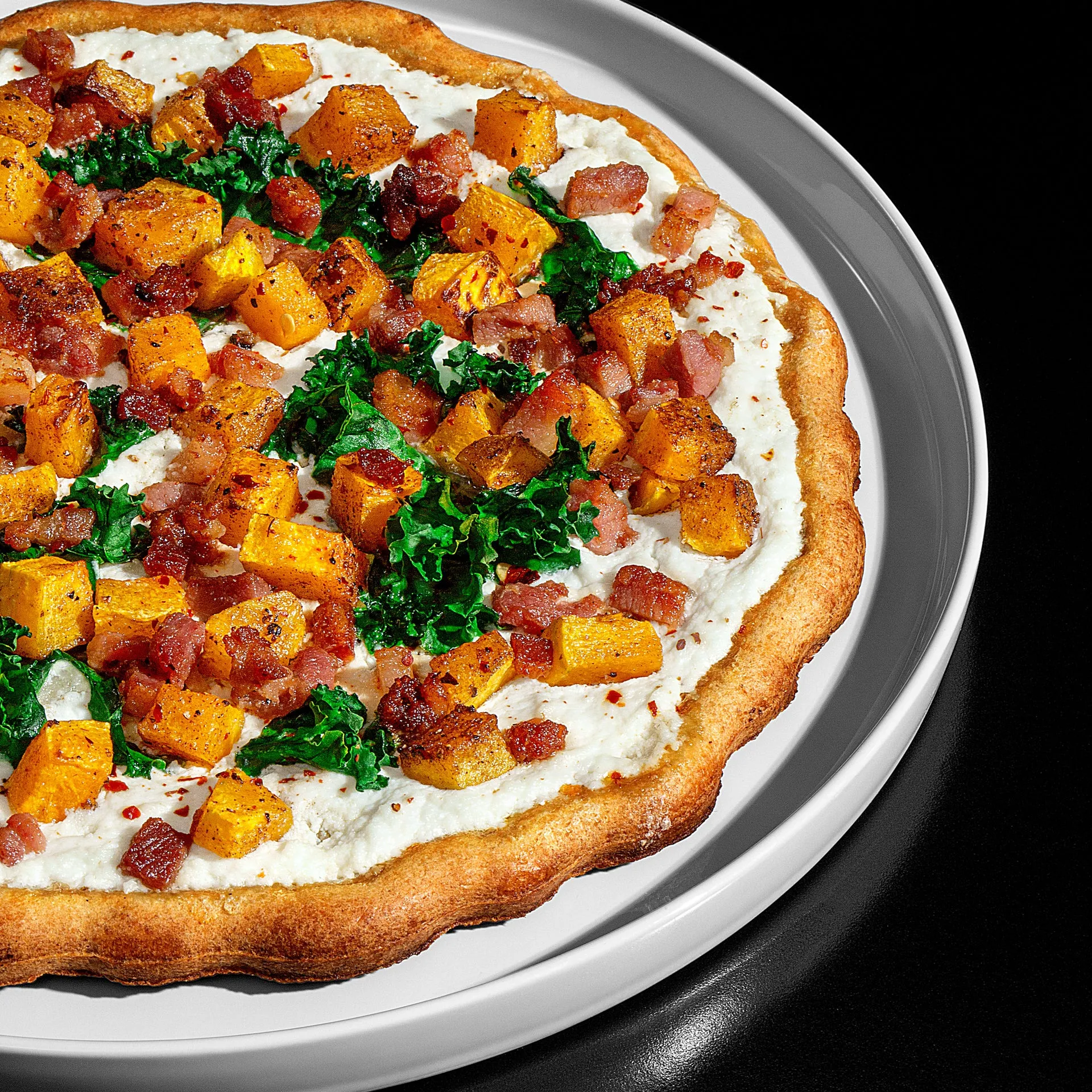 Fall Harvest Pizza with Apples, Candied Bacon, Broccolini, and Kale