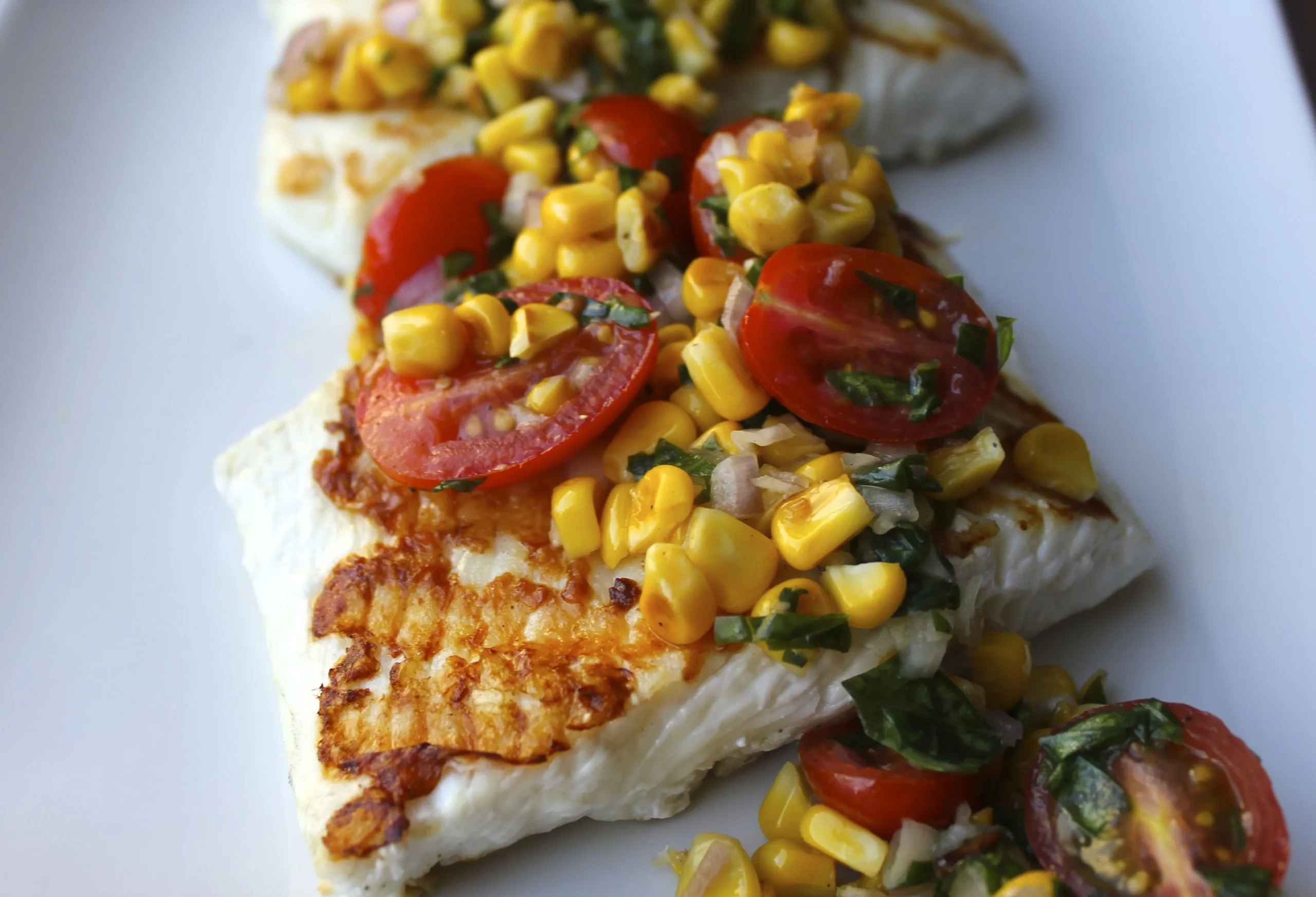 Grilled Halibut with Corn Coconut Curry Sauce and Grilled Cherry Tomato Chutney by Bobby Flay
