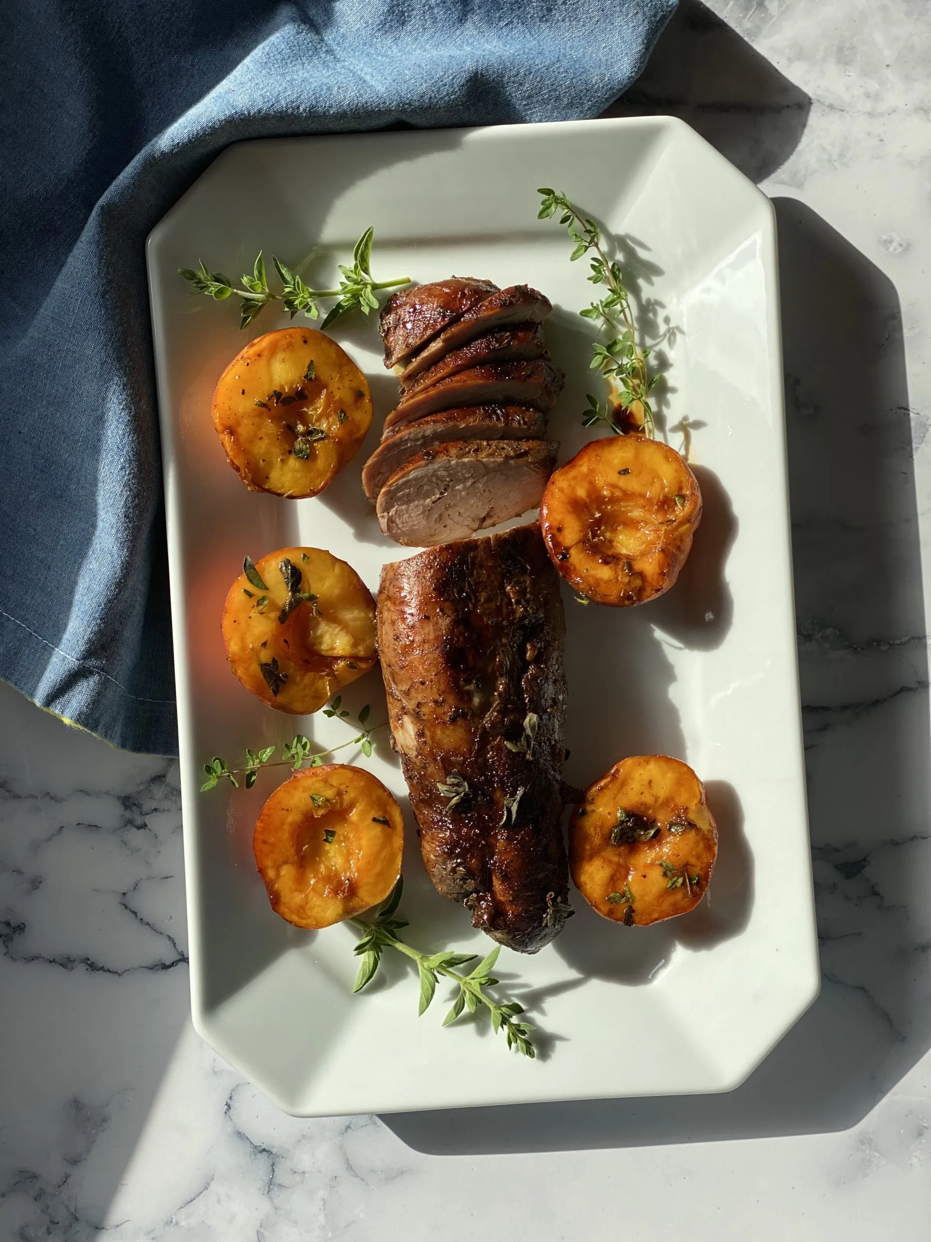 Grilled Pork Tenderloin with Wilted Greens, Sweet Onions & Peach Vinaigrette