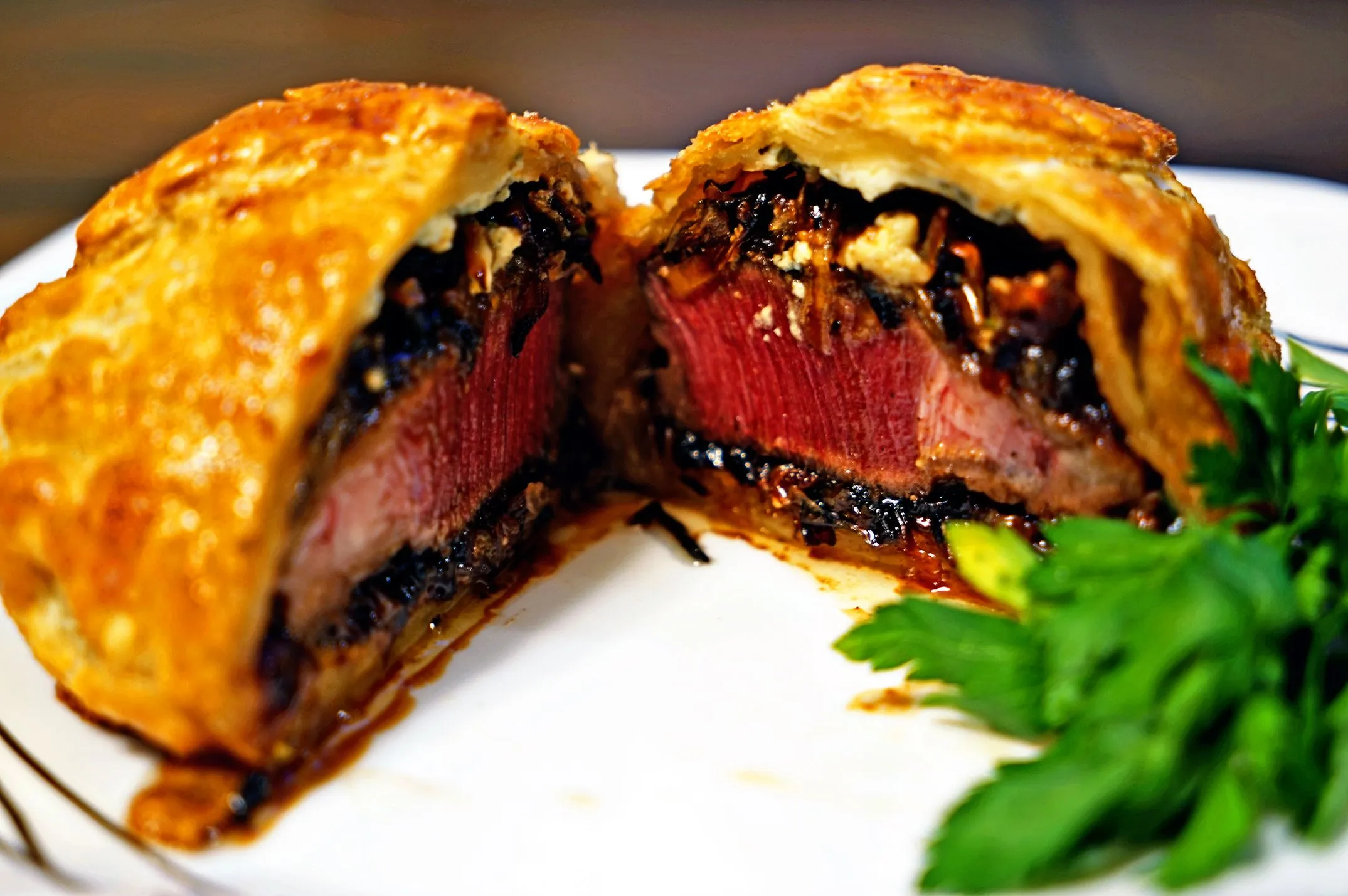 Individual Beef Wellingtons with Caramelized Onions, Bleu Cheese, and Rosemary Compound Butter
