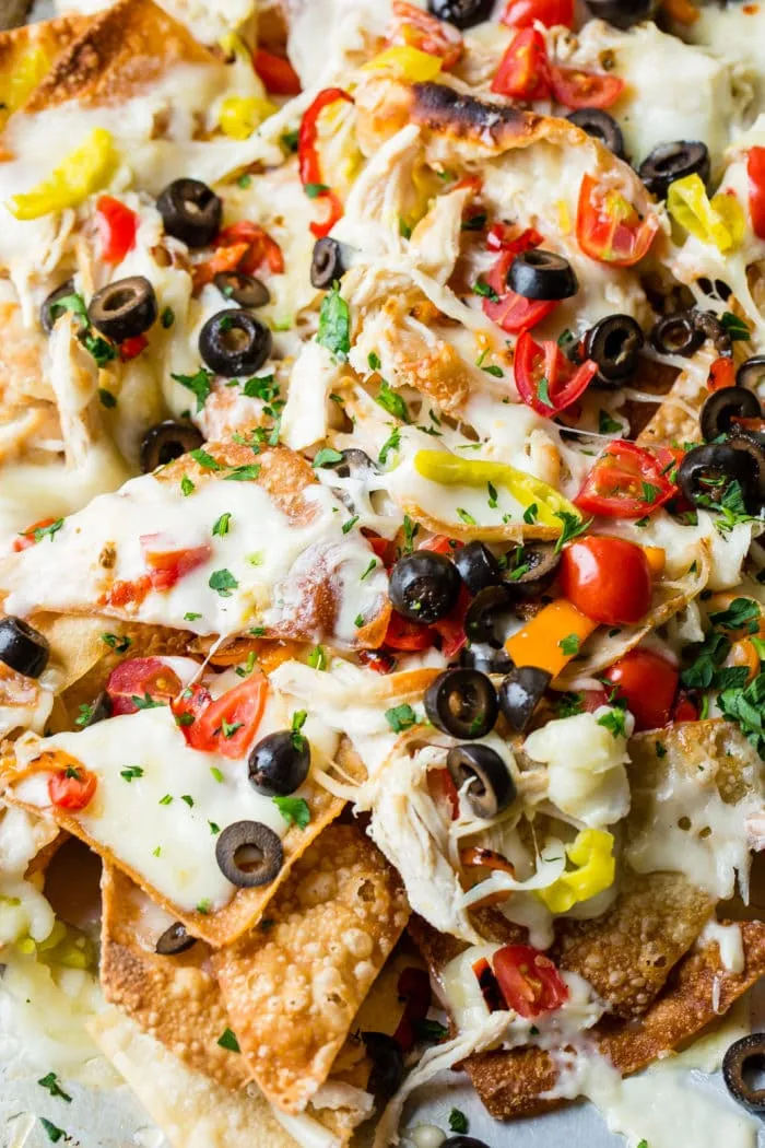 Italian Style Nachos with Provolone Cheese Sauce, Turkey Italian Sausage, and Roasted Red Peppers