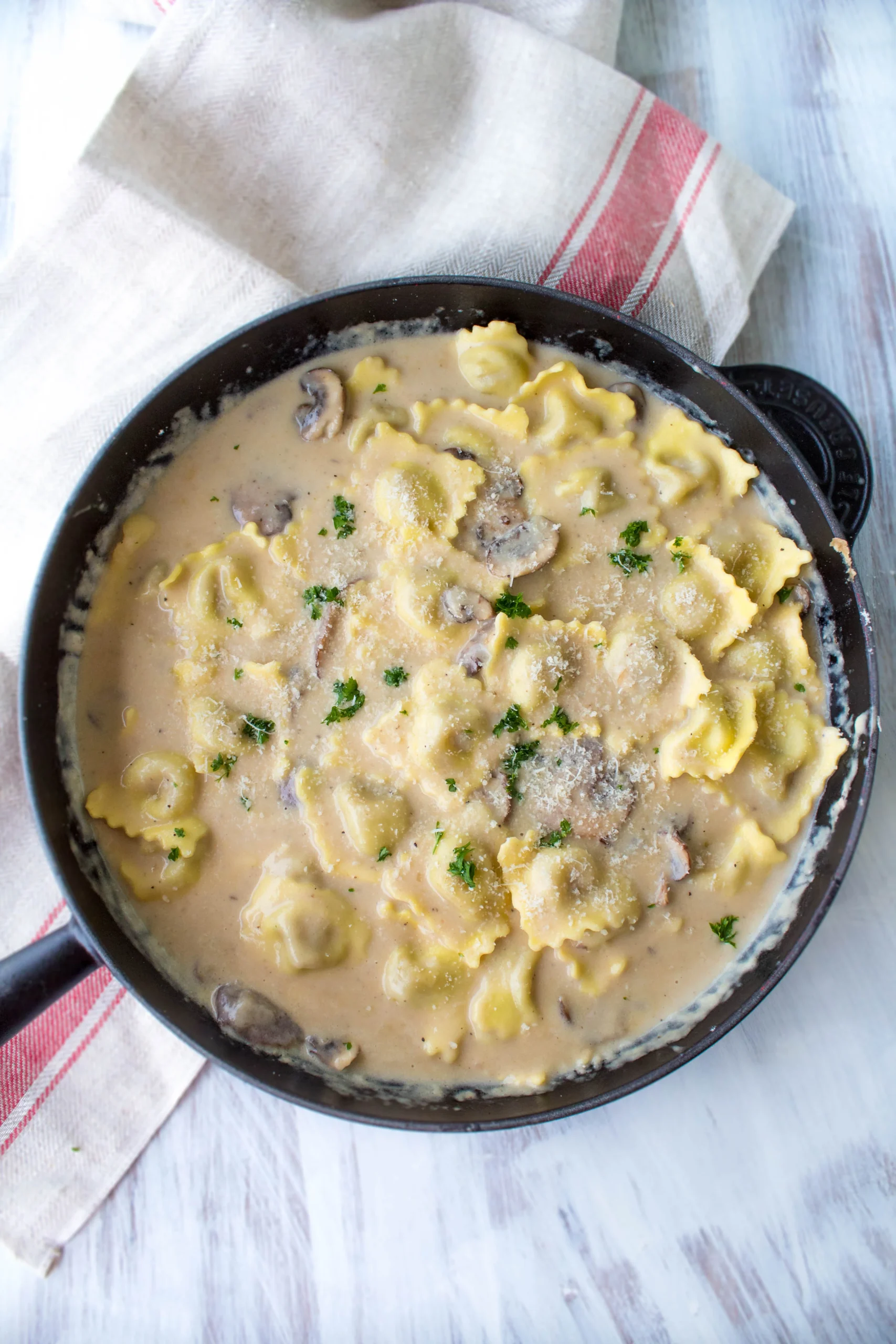 Mushroom Ravioli with Roasted Tomato Sauce and Shaved Parmesan