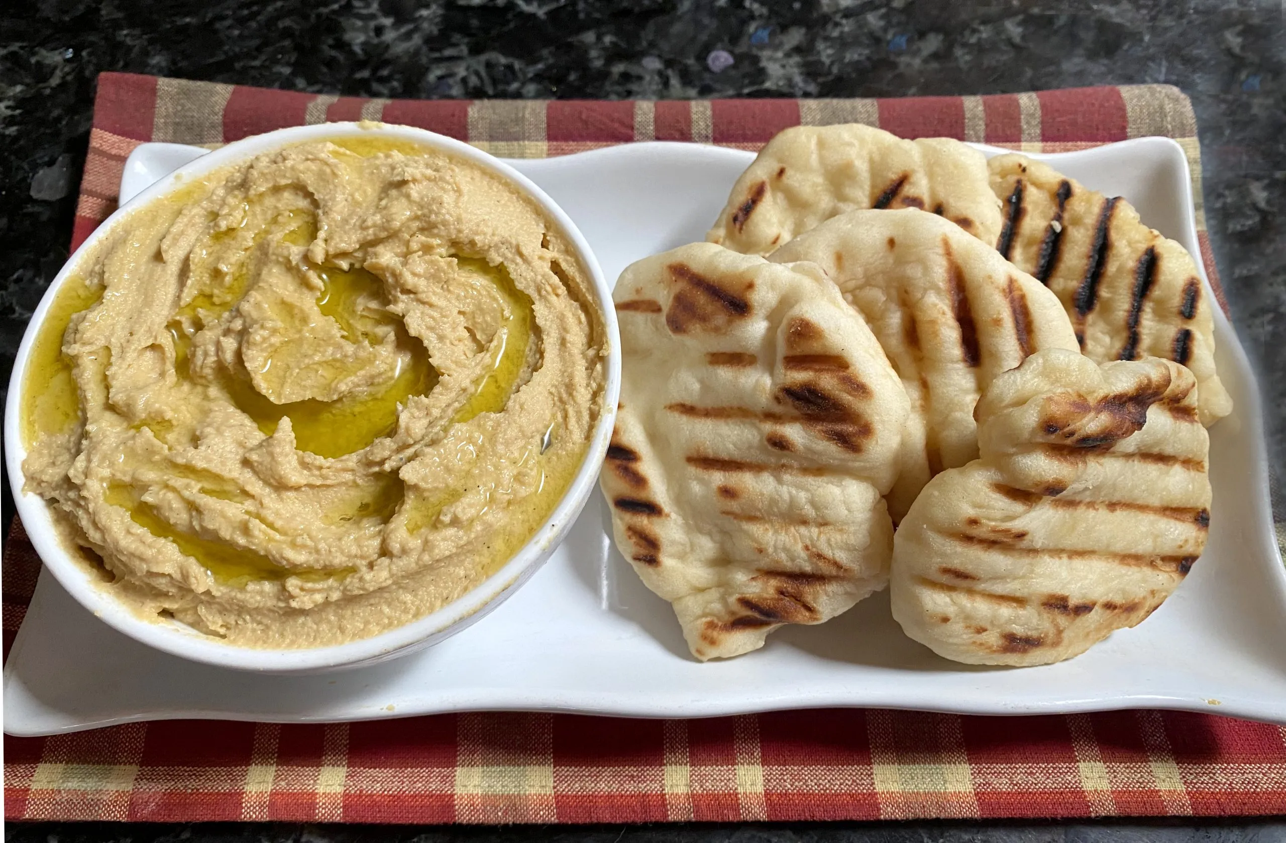 Naan Bread with Curry Butter Yogurt Dip and Spicy Hummus