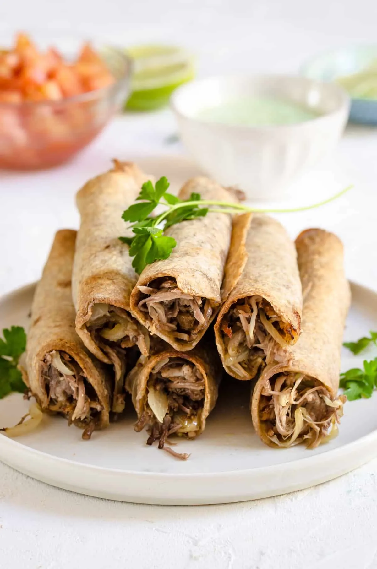 Oven Baked Pulled Pork Flautas with Avocado Crema