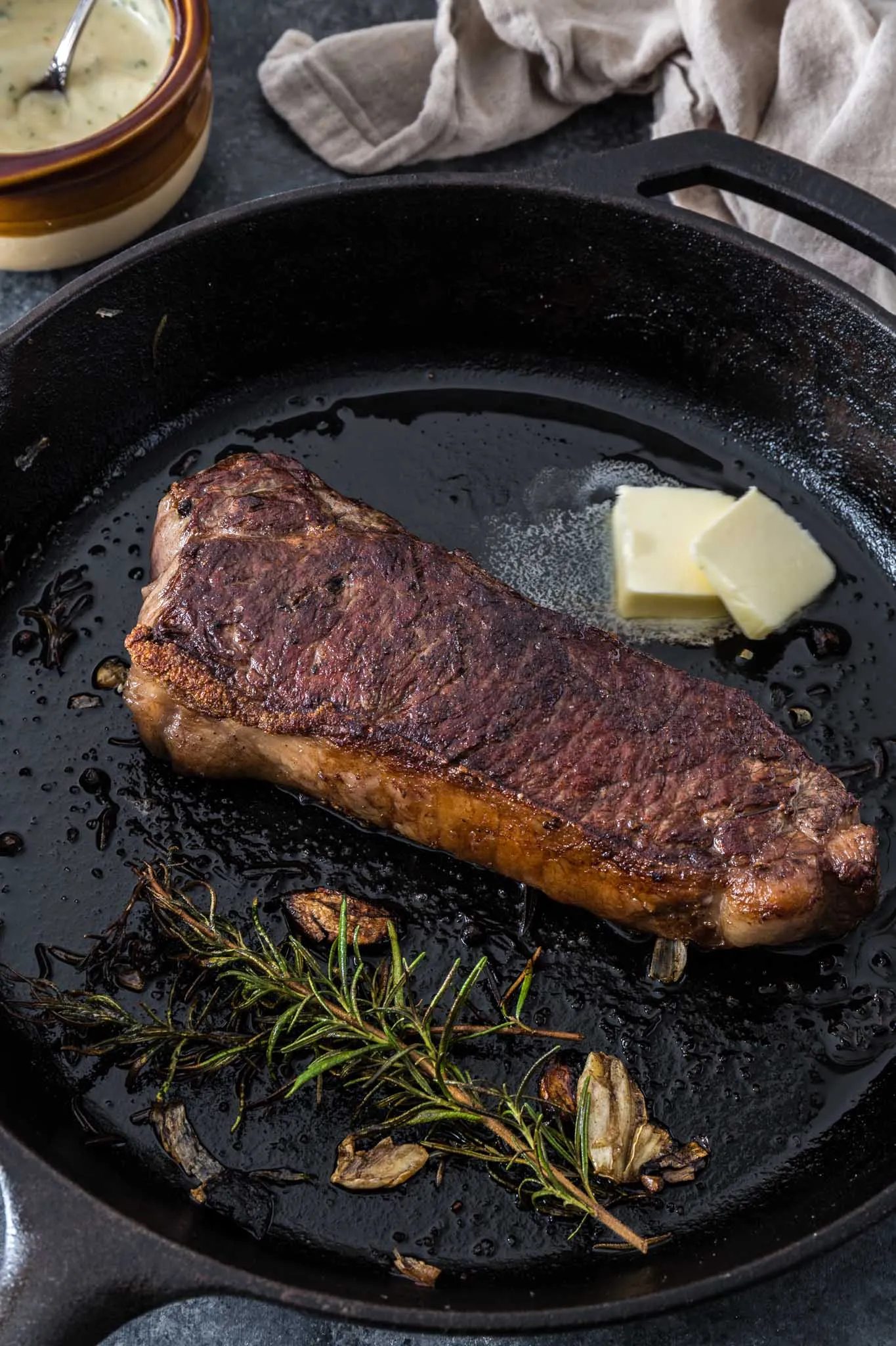 Pan Seared New York Strip Steak with Garlic Butter Sauce Onions