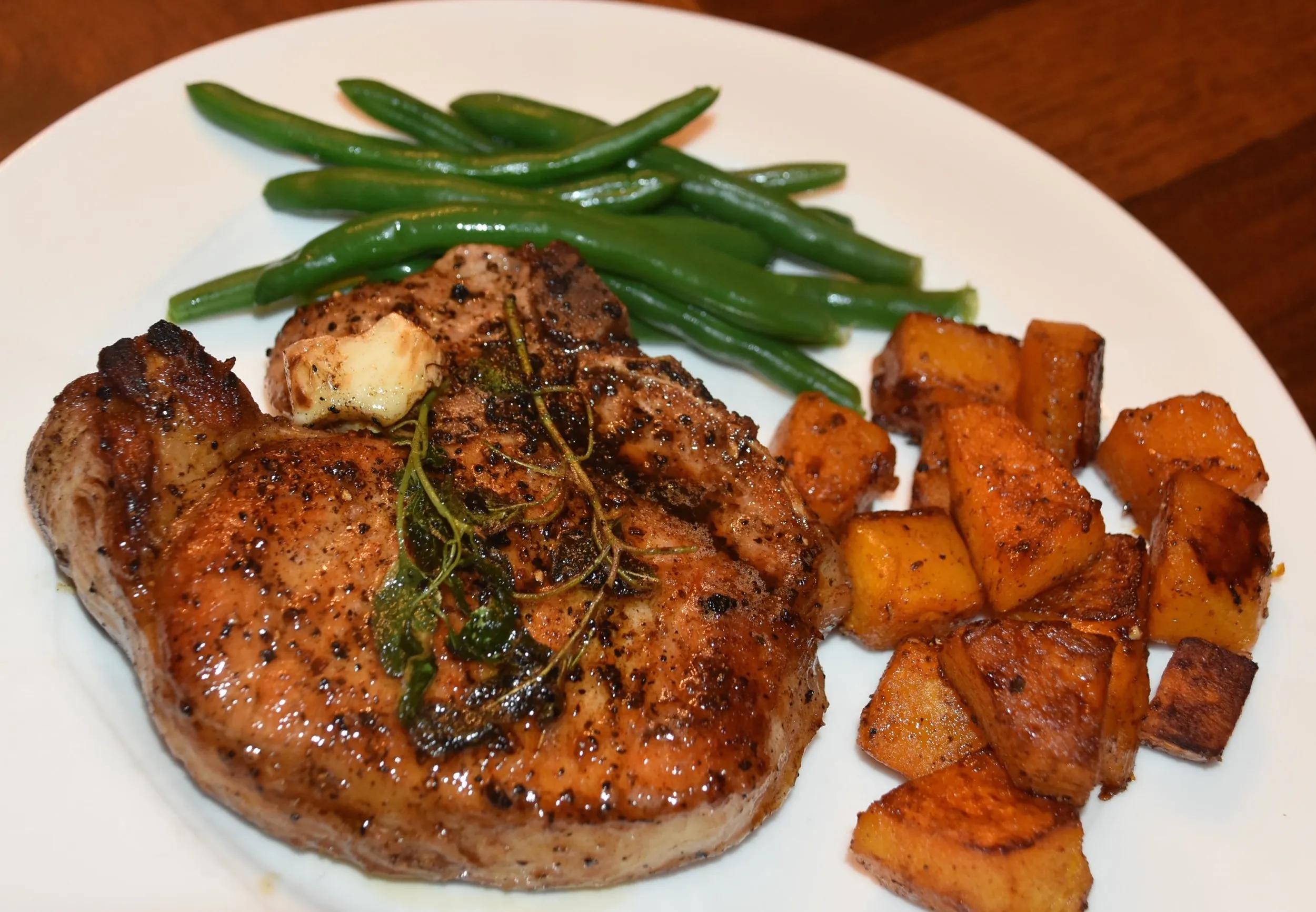 Pan Seared Pork Chops with Spinach and Black Eyed Peas