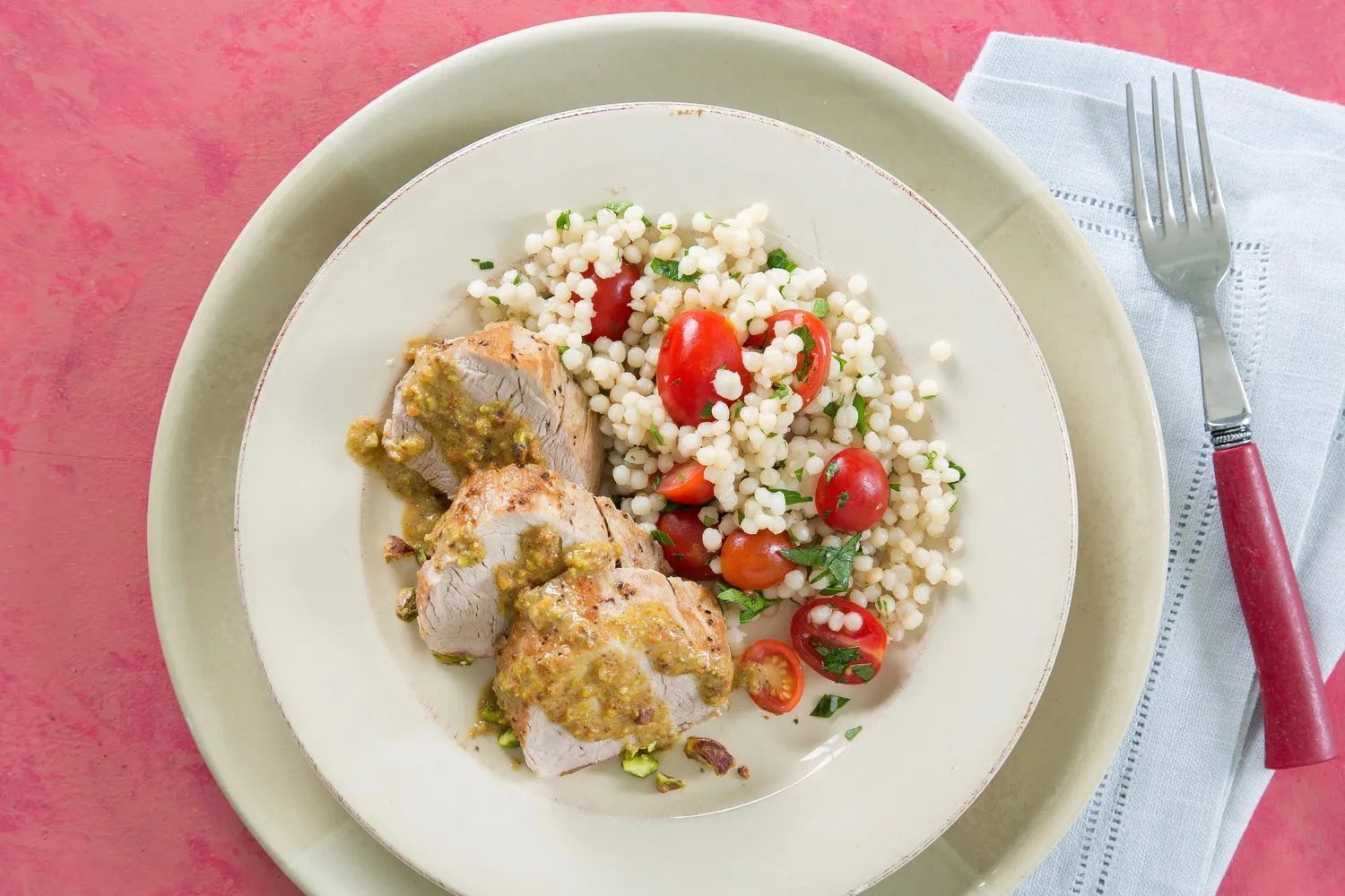 Pork over Couscous with Pistachio Lemon Vinaigrette