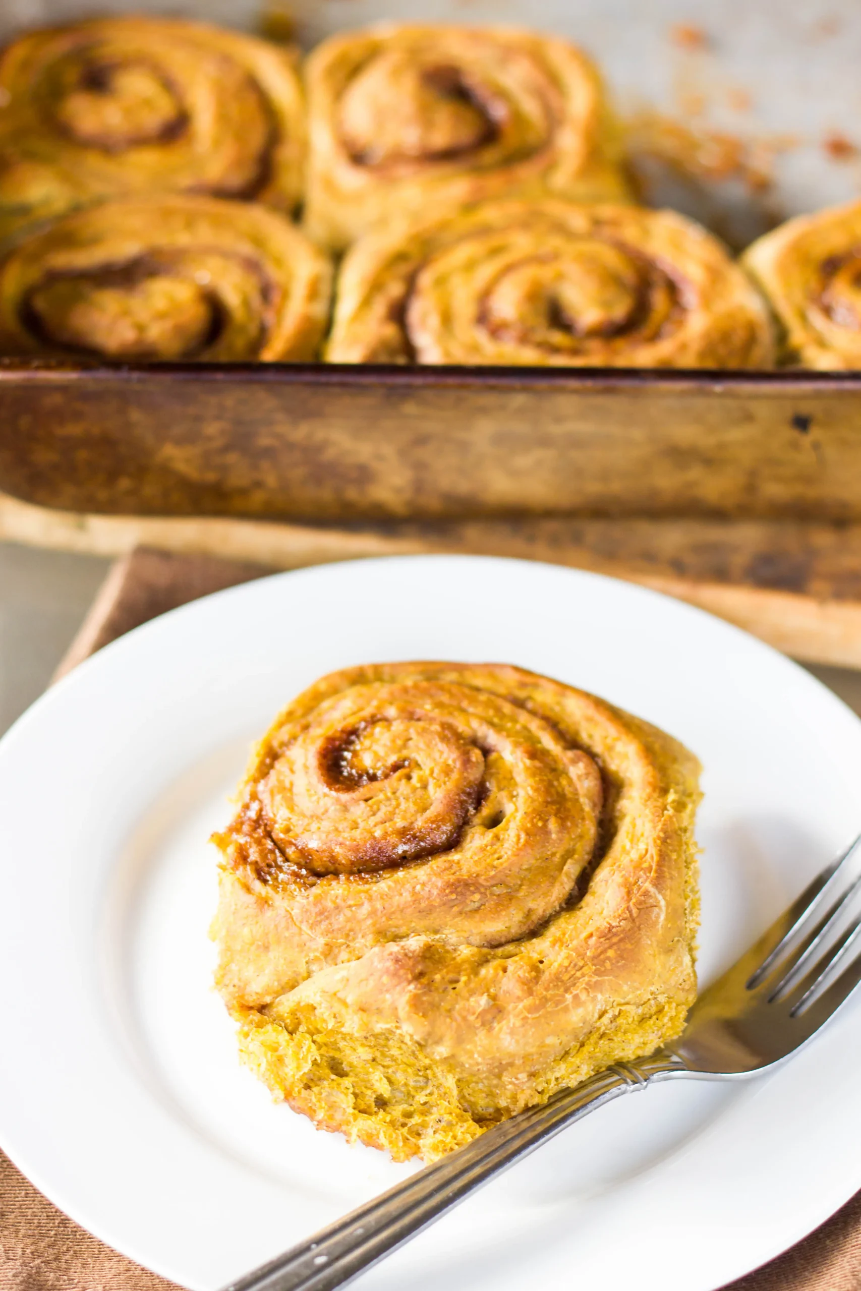 Pumpkin Cinnamon Rolls with Maple Cream Cheese Glaze