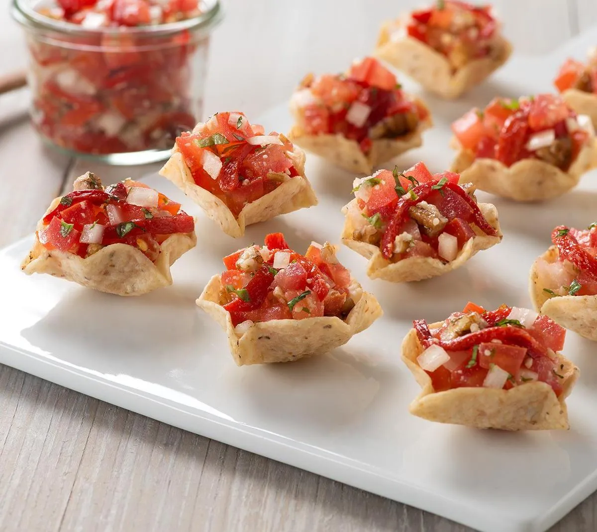 Red Pepper Pesto Bruschetta with Fresh Parmesan in Tostitos Scoops