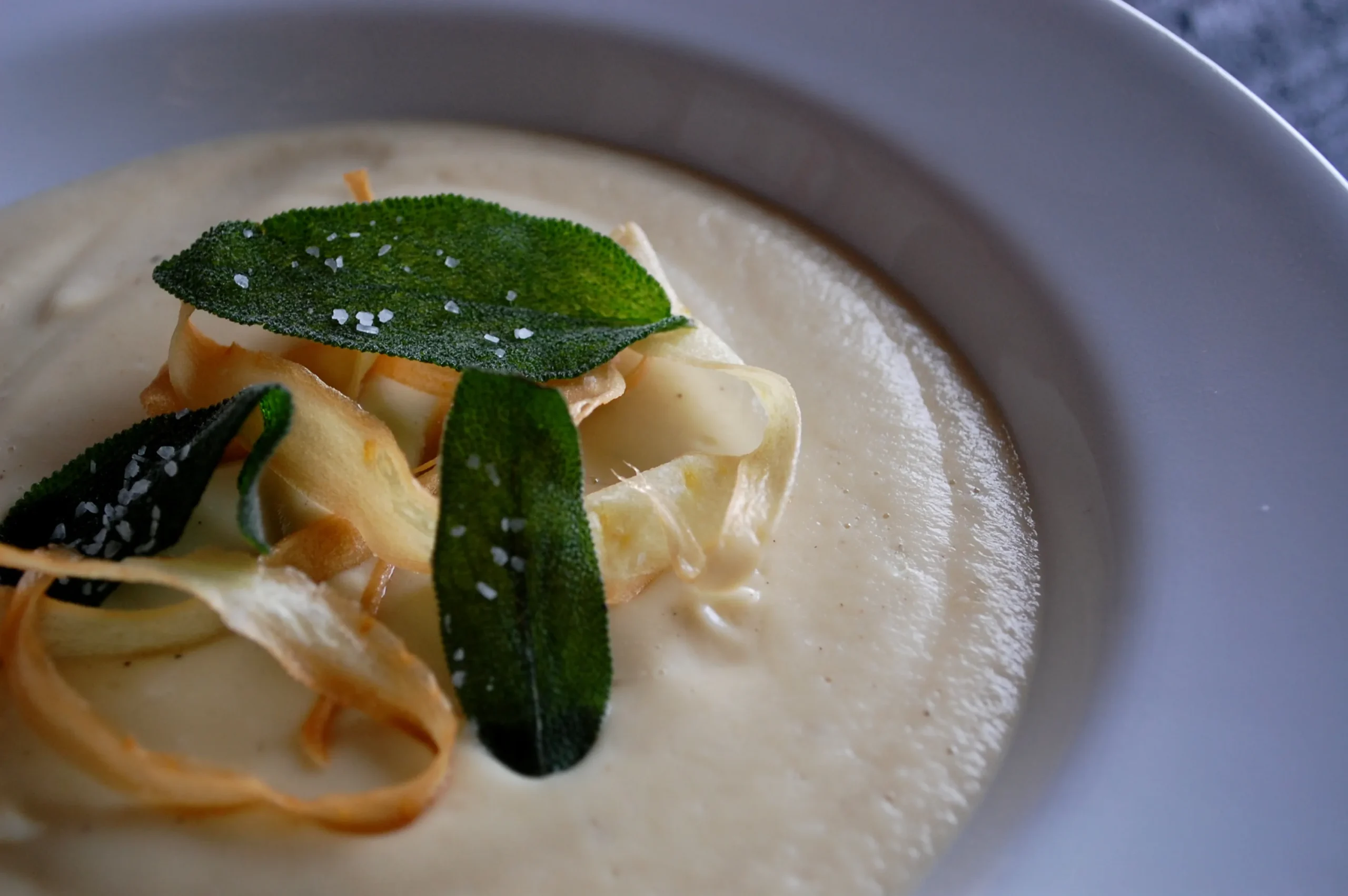 Roasted Garlic Parsnip Soup with Brown Butter, Walnuts, and Dates