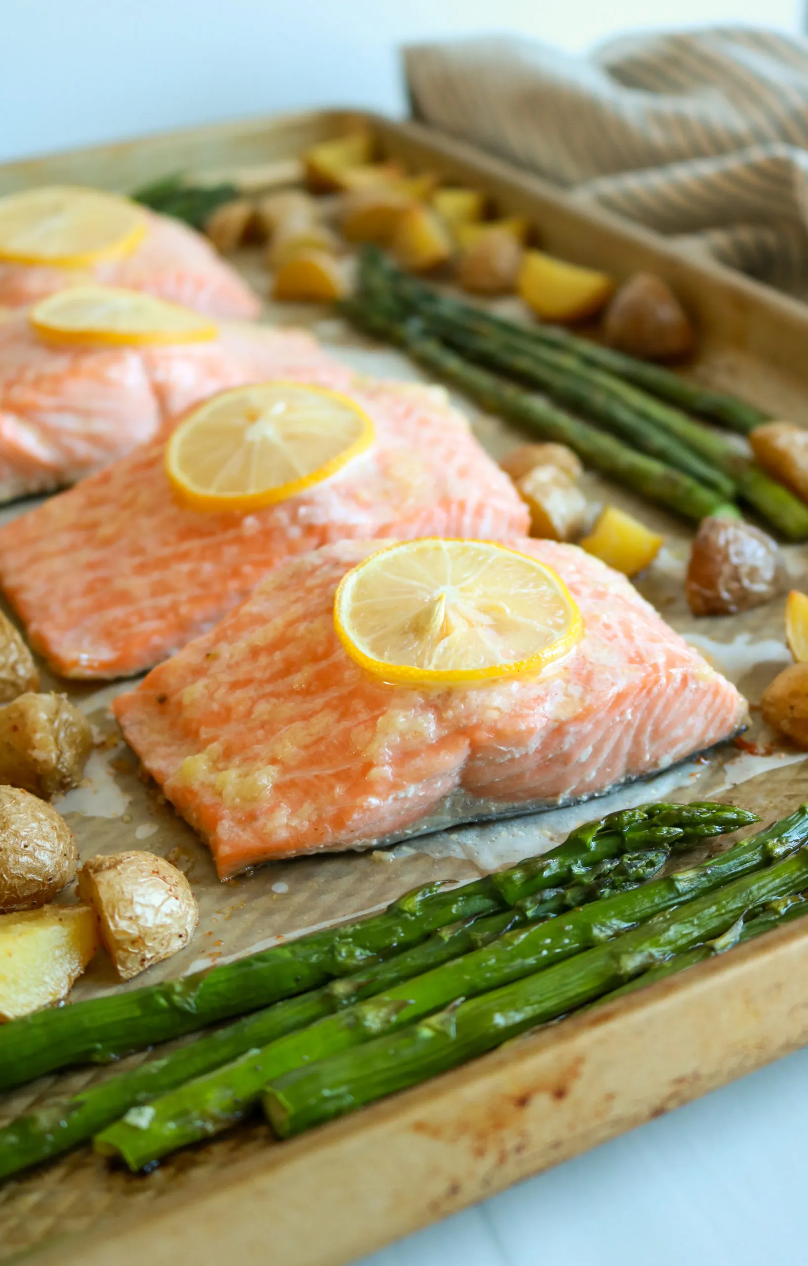 sheet pan garlic butter salmon with roasted potatoes and asparagus
