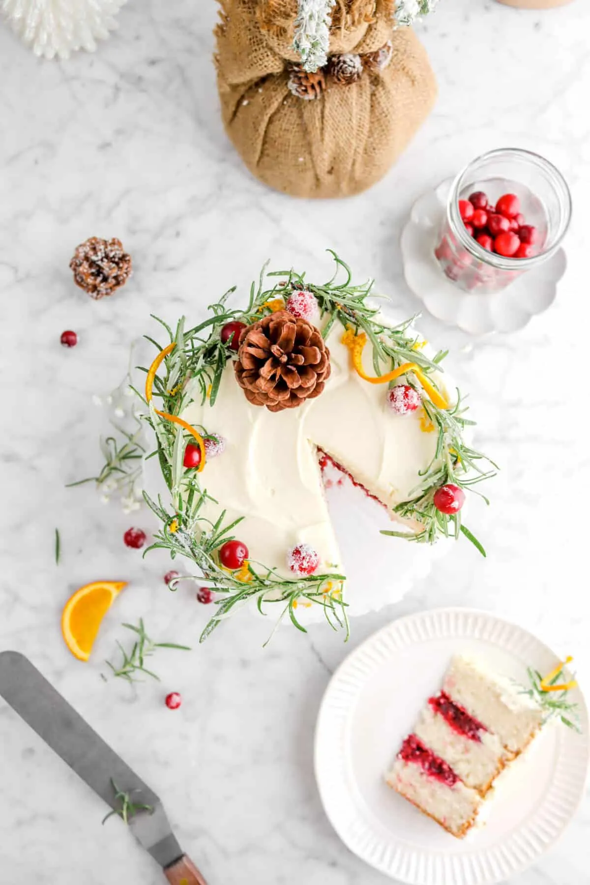white christmas cake with cranberry orange filling and whipped white chocolate ganache frosting